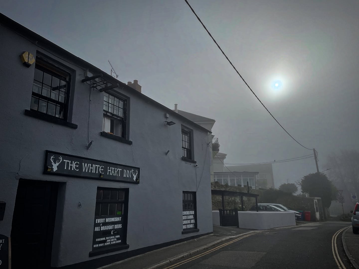 The White Hart Inn exterior on Pool Street, Bodmin in misty sunlight